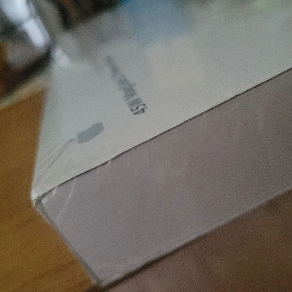 Apple 45W Magsafe 2 power adapter for MacBook Air.